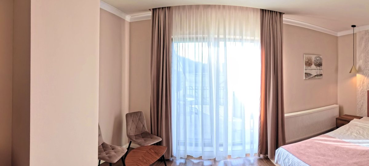 Warm double room with the mountain outside the glass