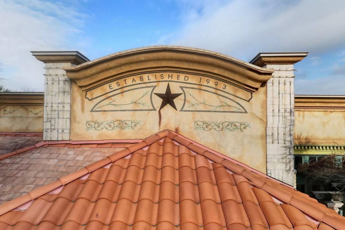 The painted facade of a Tex Mex restaurant against a blue sky
