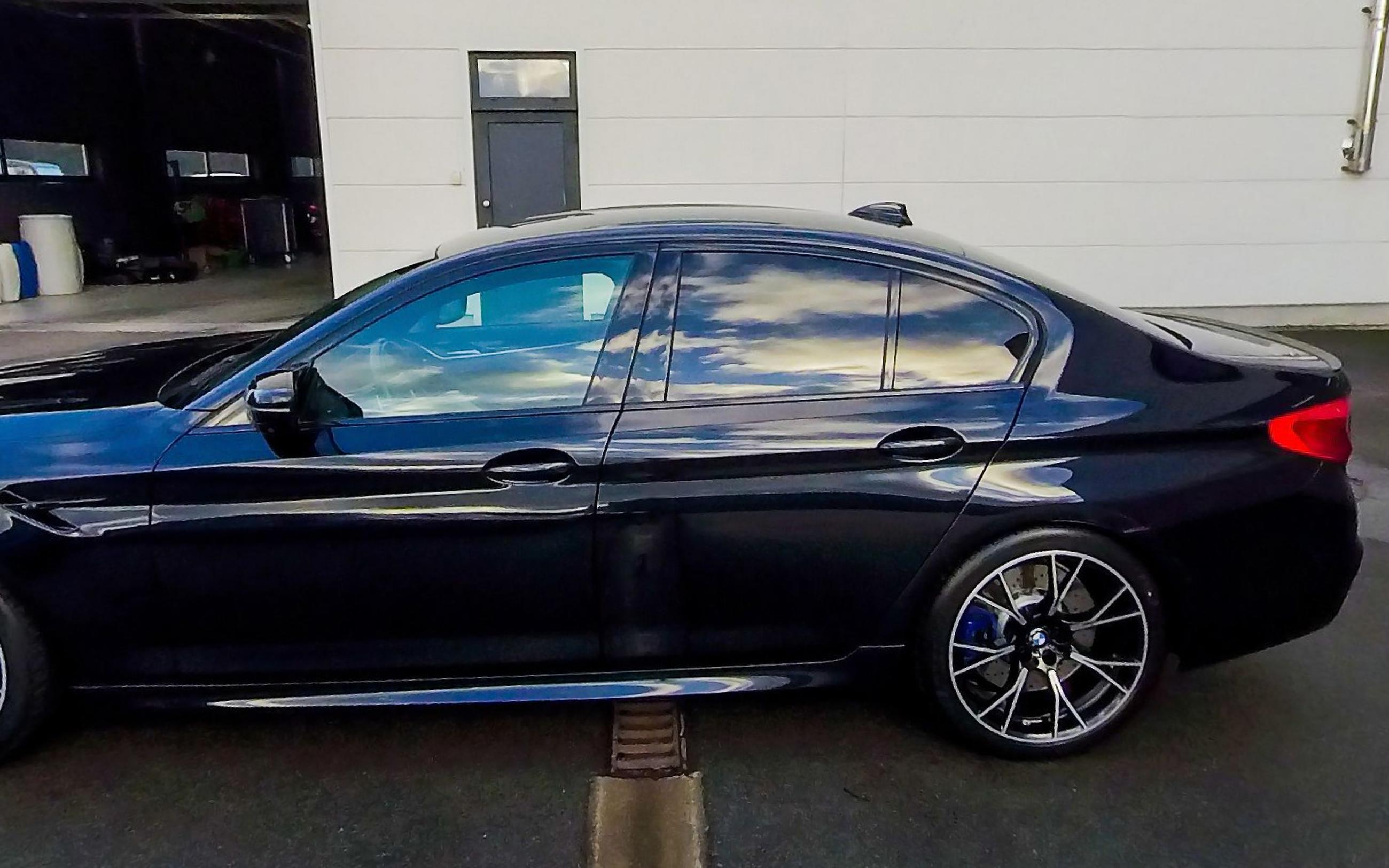 The car in full side profile with both wheels visible