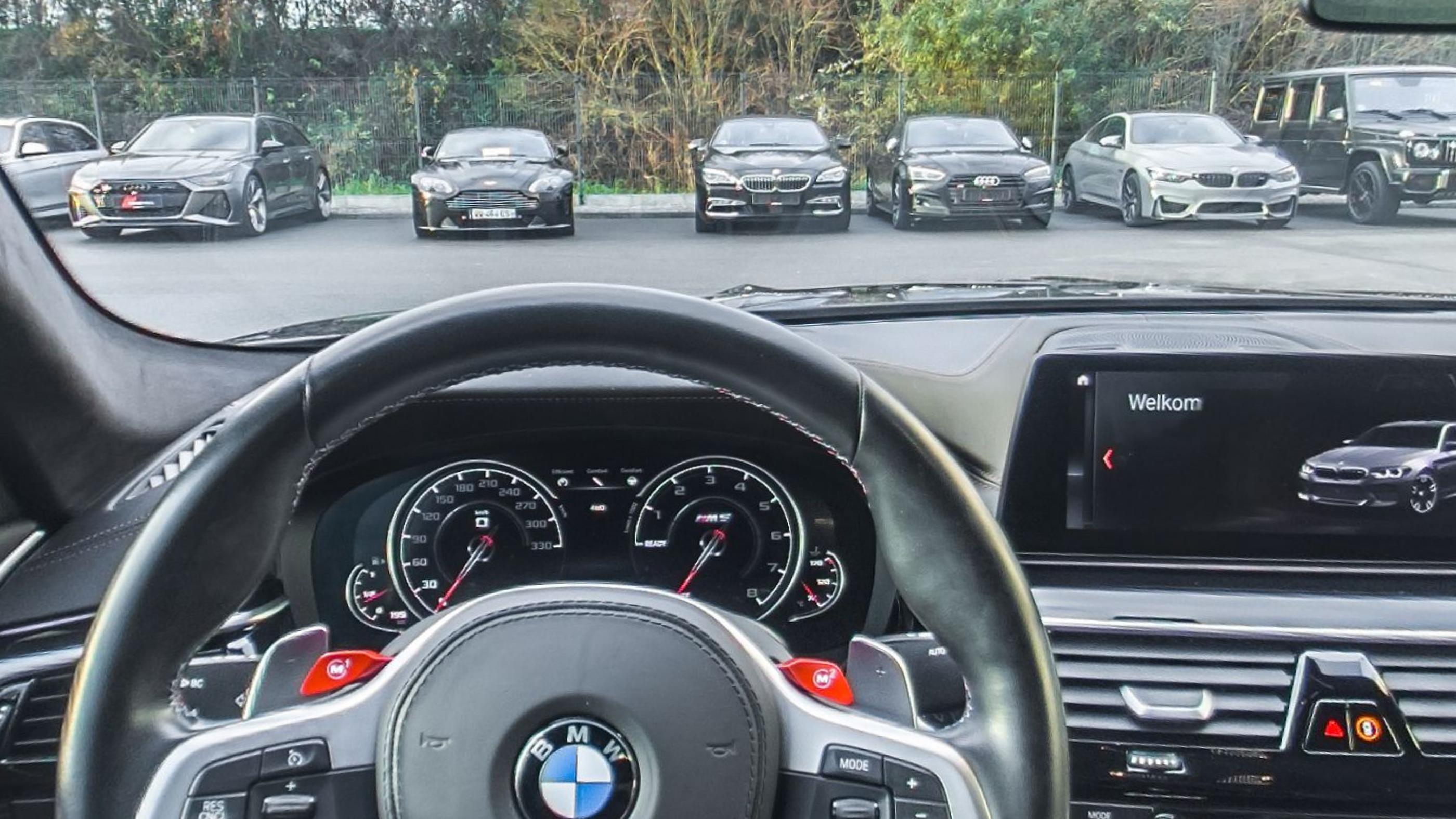 The M steering wheel, instrument dials and centre screen from the driver's seat