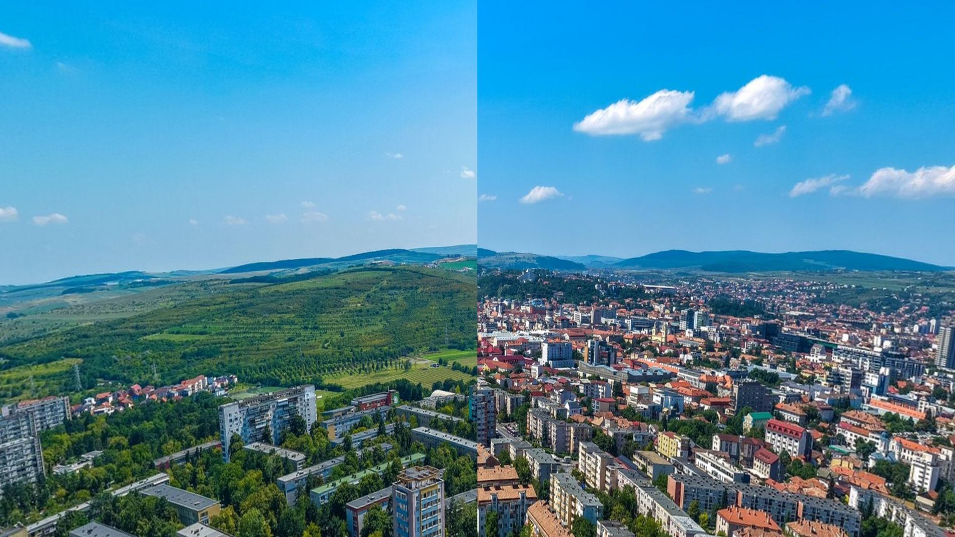 Cluj-Napoca seen from above, rooftops running to the hills