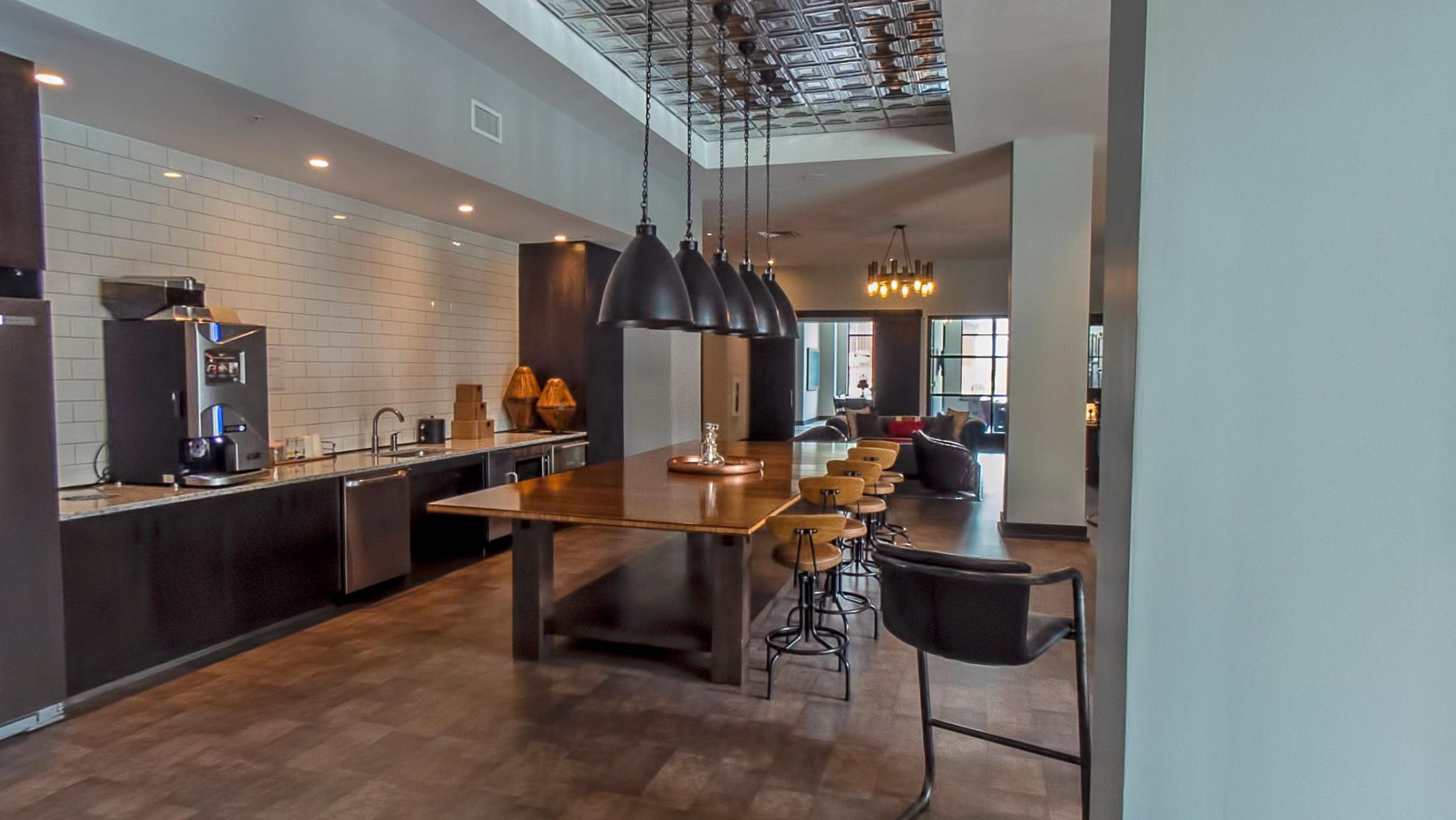 The coffee bar, pendant lights over an island