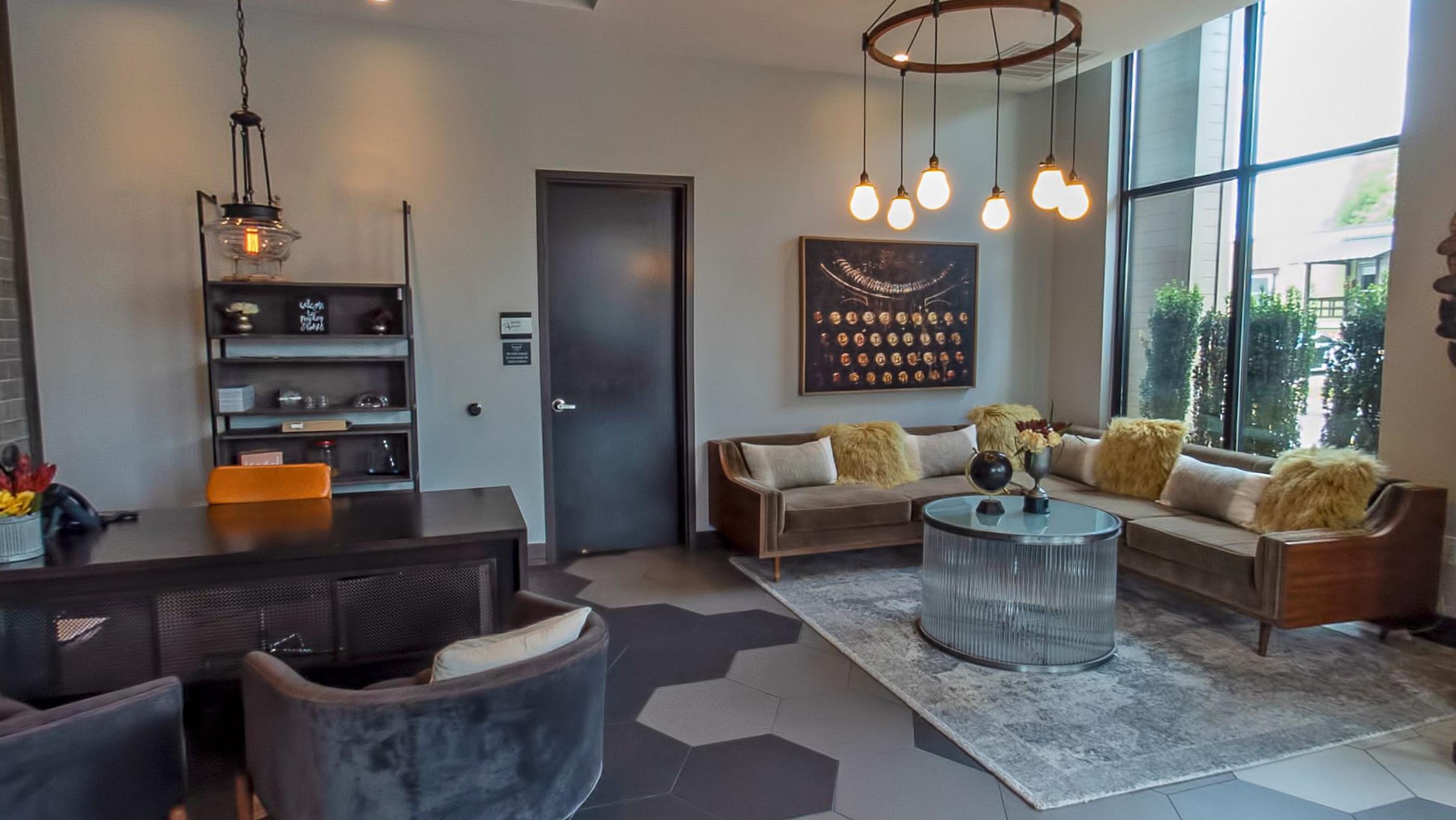 The residents lounge, sofas under a tall window