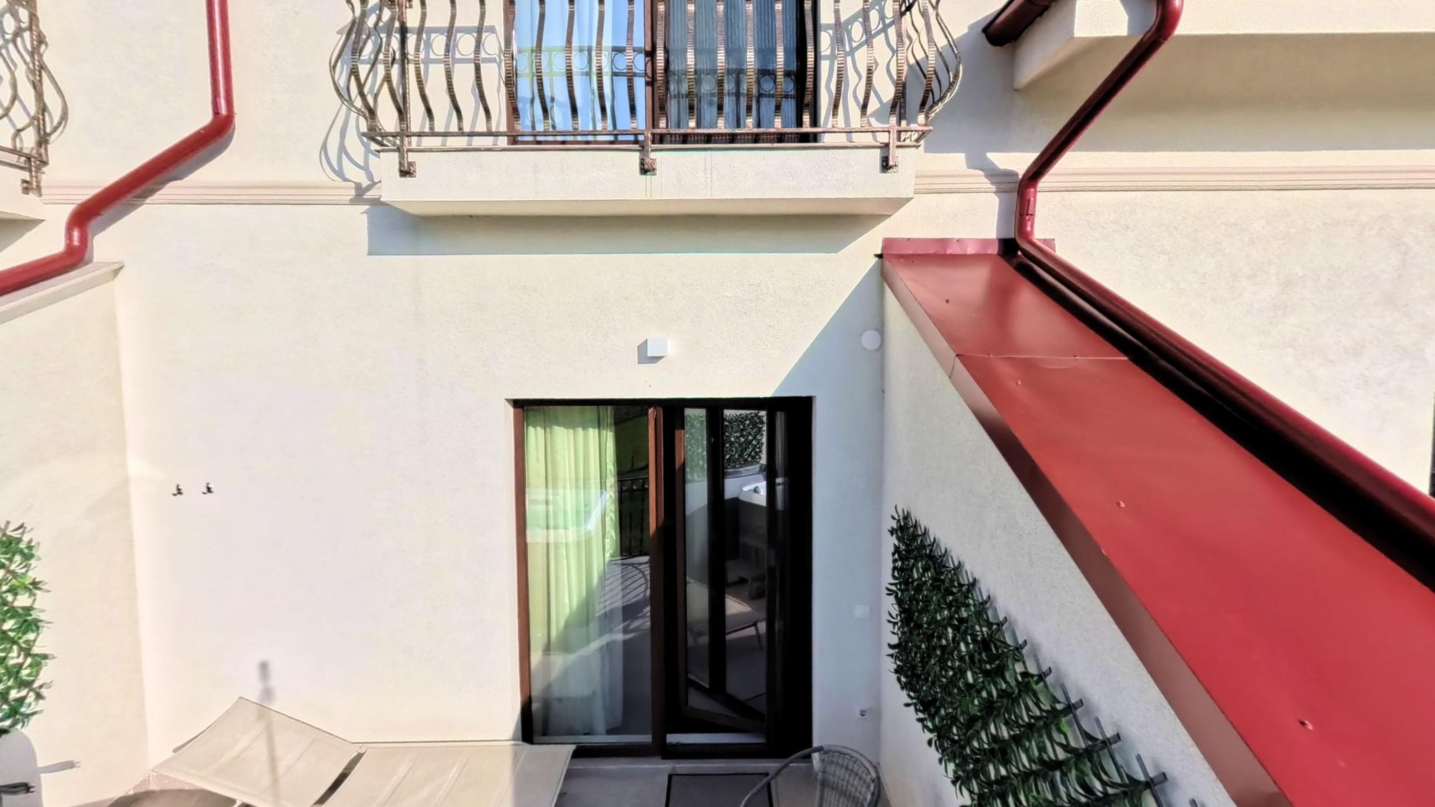 Terrace and pool area seen across the lawn