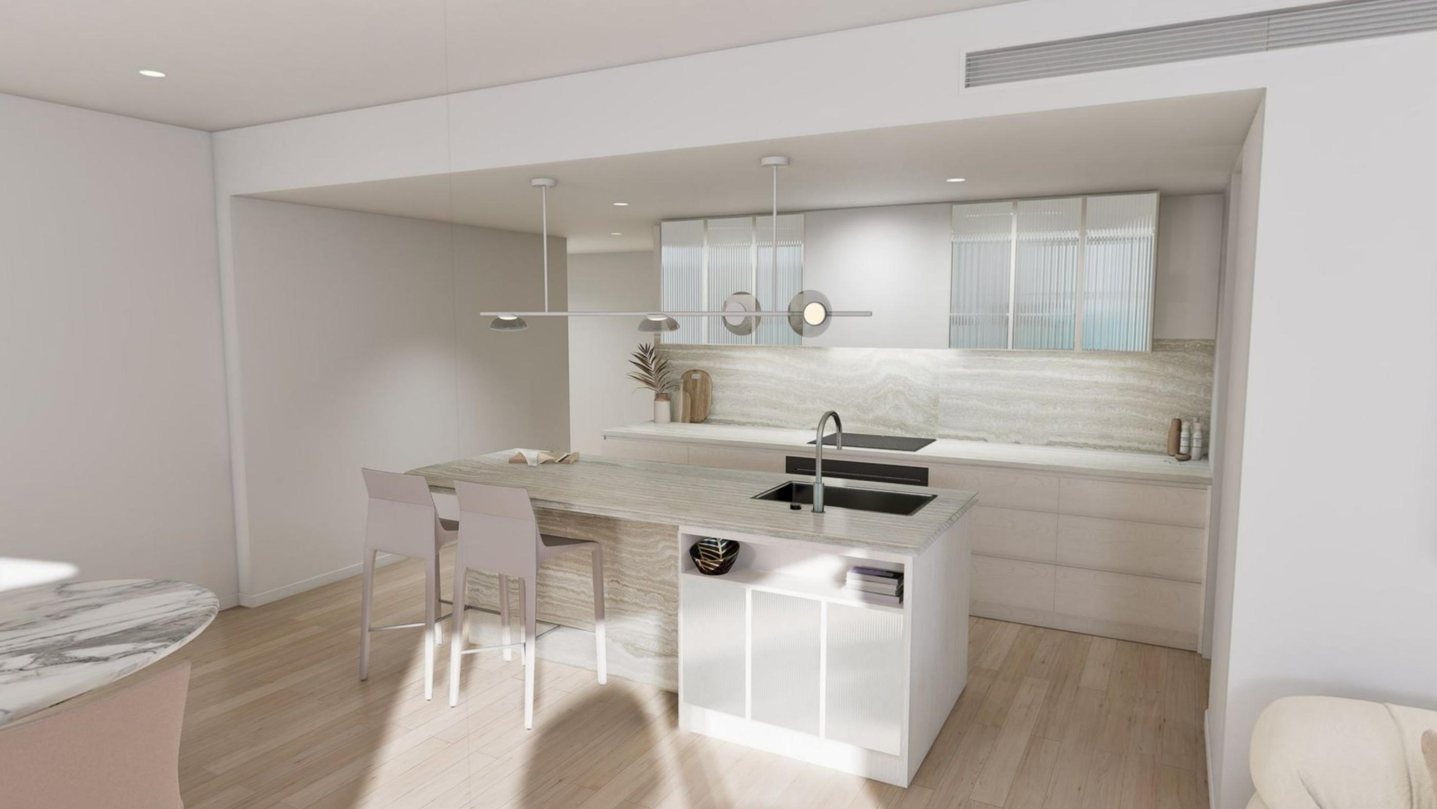 A pale stone kitchen island with stools, integrated appliances and a marble splashback