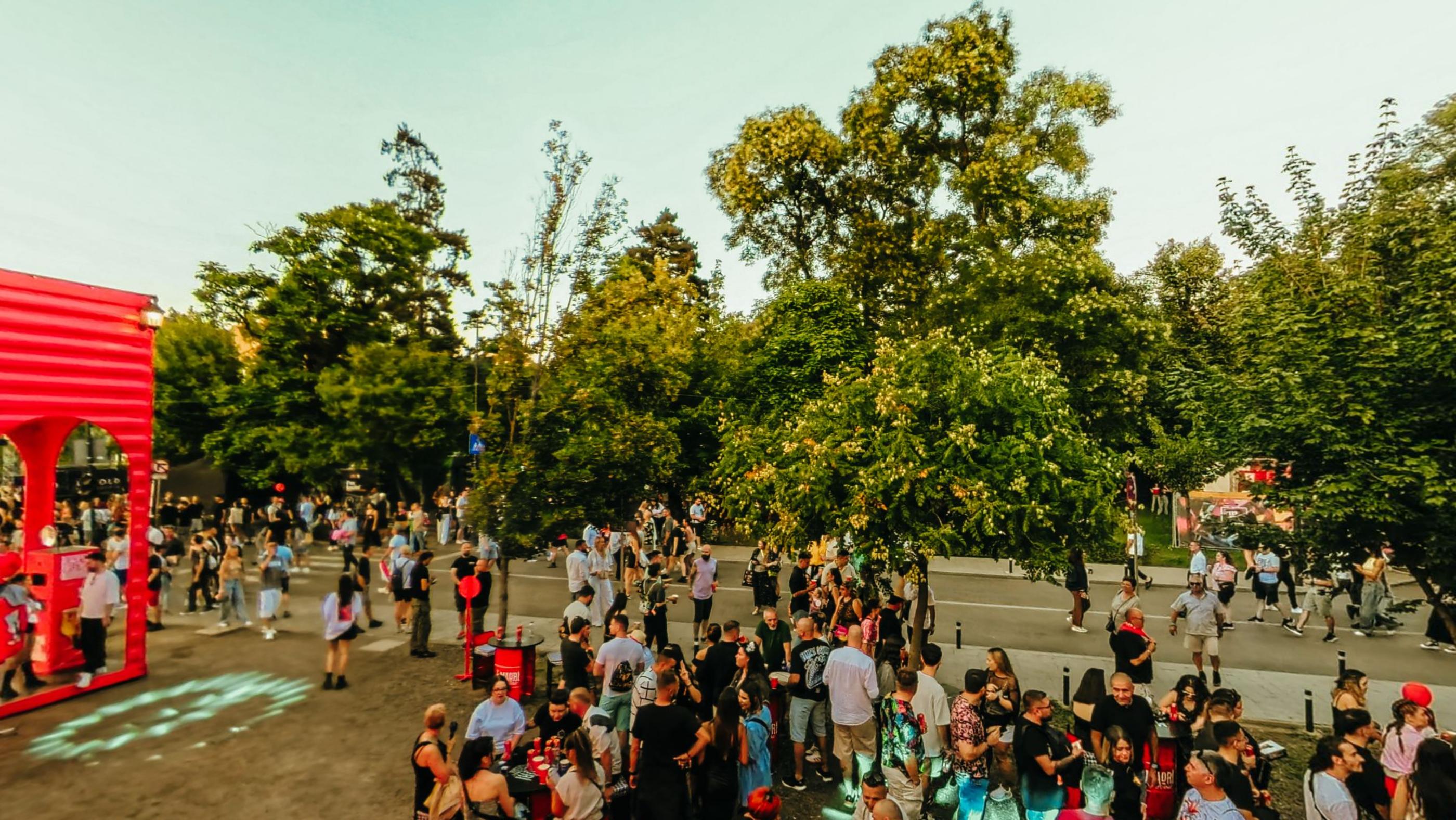The crowd filling the ground between the stages as the light drops