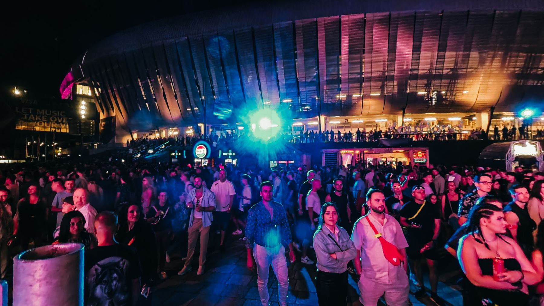 The crowd outside the arena at night
